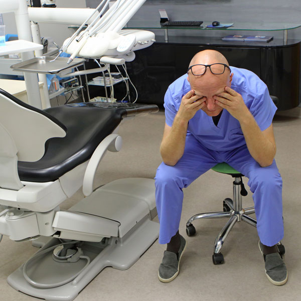 Dentist showing stress in dental practice