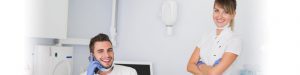 Female and male dentists smiling in operatory