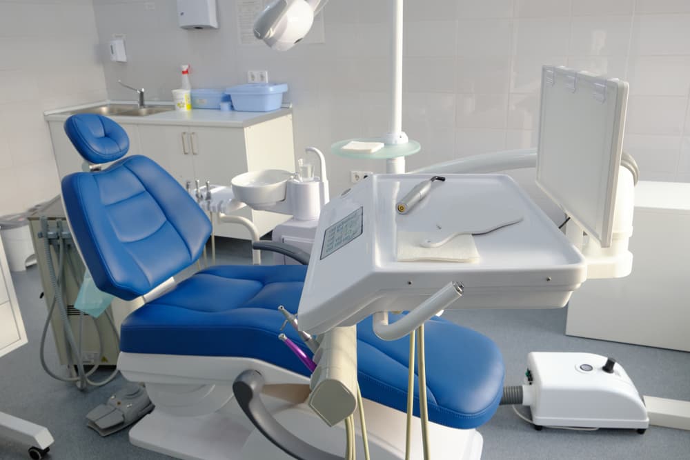 Photo showcasing the dental office, featuring the chair and dental unit.