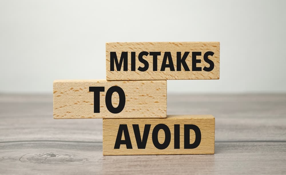 Mistakes to avoid written on wooden blocks