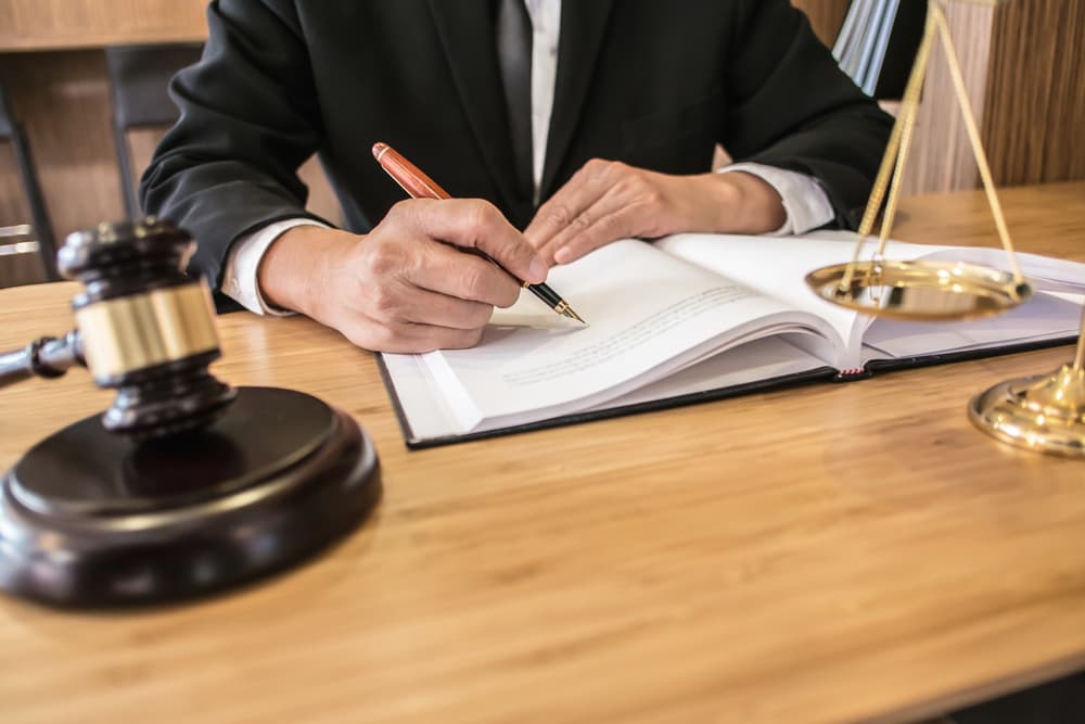 Lawyer discuss the contract and legal document agreement in office. 