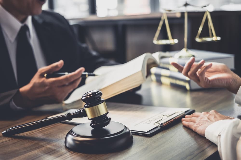 Lawyer having team meeting with client, Law and Legal services