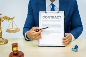 Lawyer presenting a contract document during a consultation in an office setting.